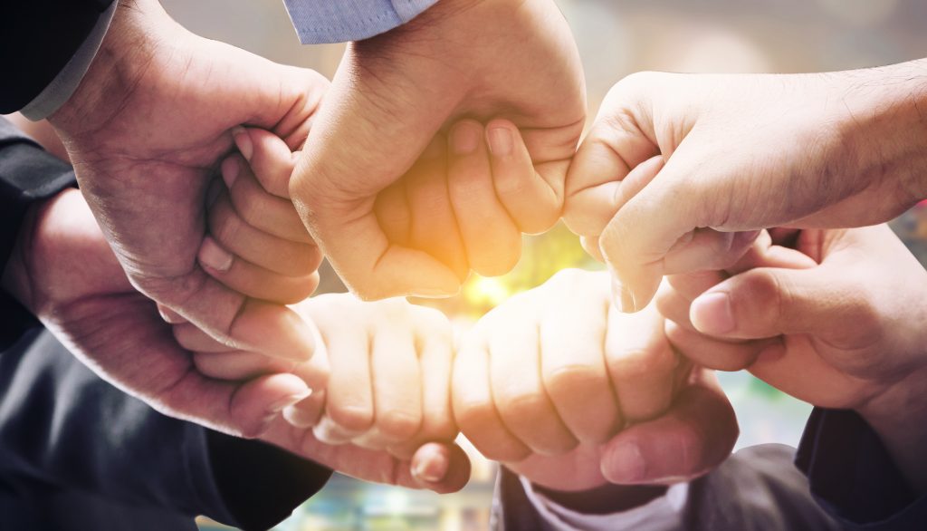 Business people team joining hands.