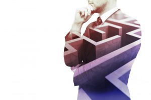 Young,Businessman,Thinking,About,Ways,To,Overcome,Business,Obstacle.,Isolated
